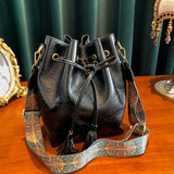 realaiot  Vintage Textured Bucket Bag, Tassel Decor Drawstring Shoulder Bag With Retro Pattern Strap